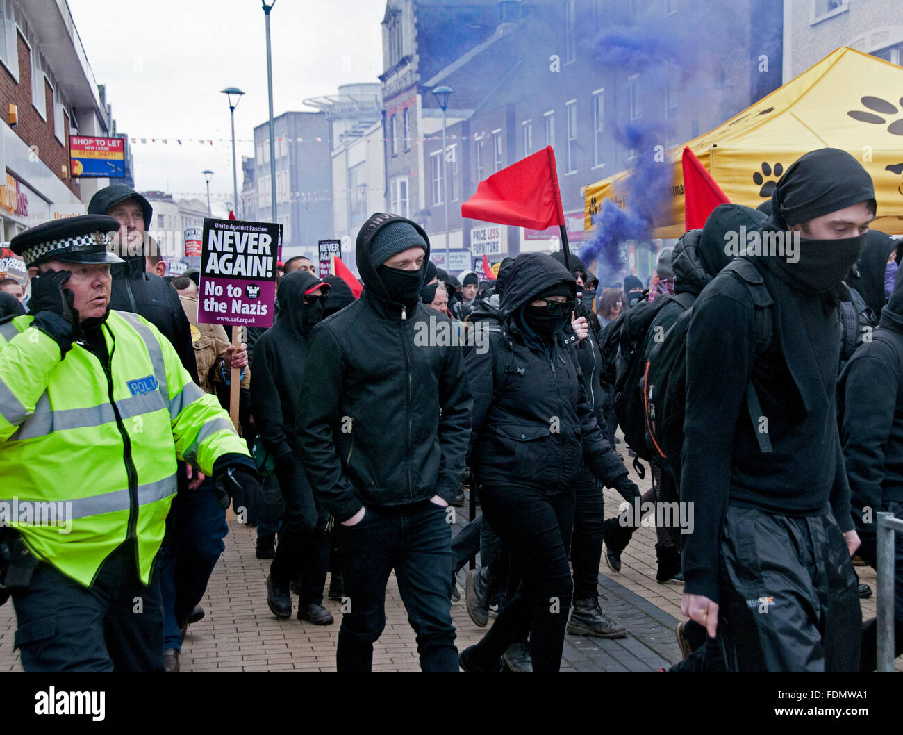 Unite Against Fascism UAF combating the Far Right  groups at Anti-Immigration anti-Refugee rally organised by the National Front Stock Photo