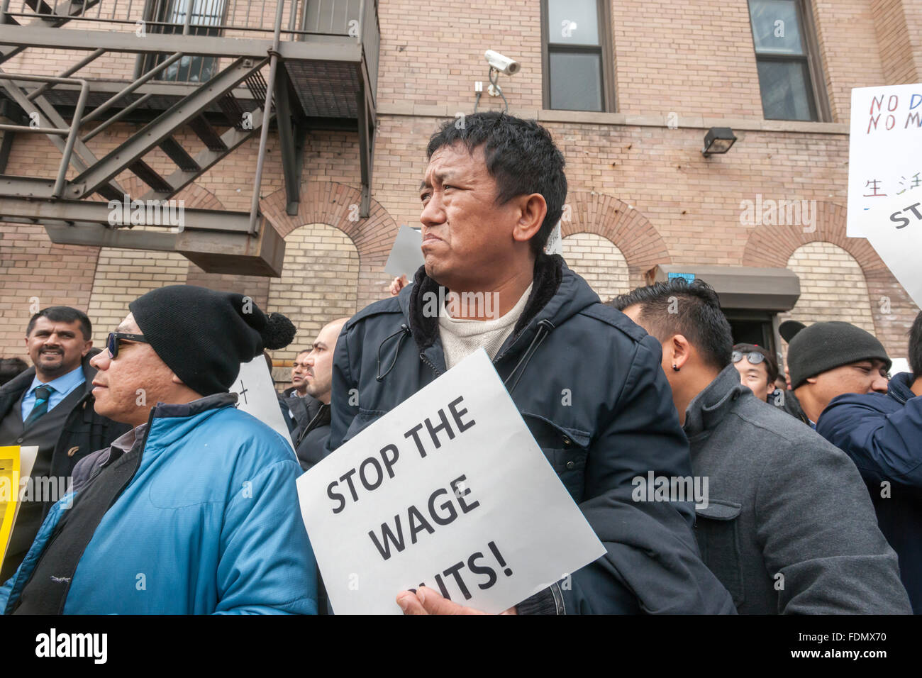 New York, USA. 1st February, 2016. Several hundred Uber drivers and their supporters strike in front of Uber's Queens offices in New York on Monday, February 1, 2016. The drivers are upset over Uber's recent 15% cut in fares meaning less money for the drivers. Uber claims that the cut will increase volume and the drivers will have less down-time. Credit:  Richard Levine/Alamy Live News Stock Photo