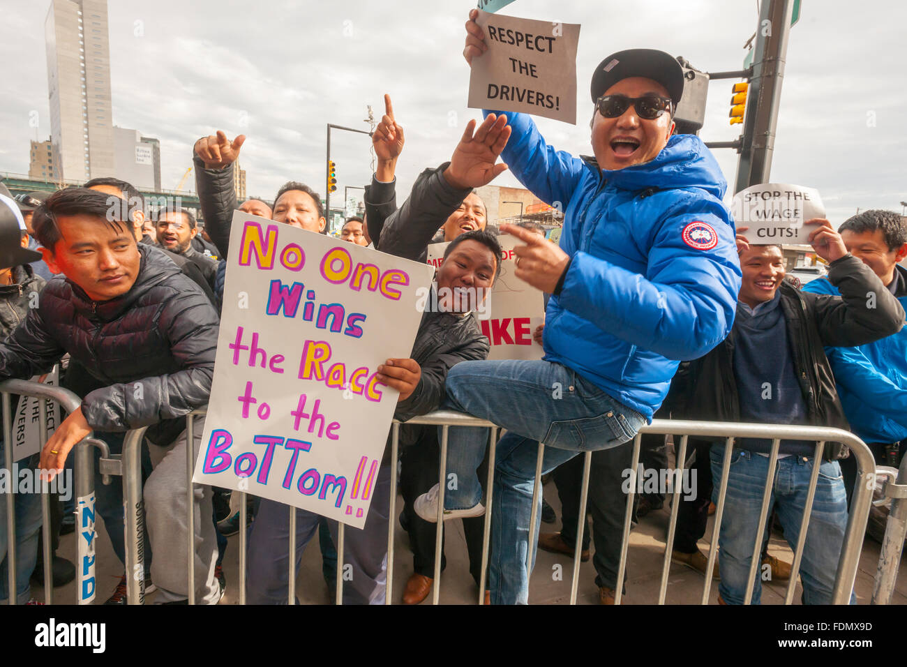 New York, USA. 1st February, 2016. Several hundred Uber drivers and their supporters strike in front of Uber's Queens offices in New York on Monday, February 1, 2016. The drivers are upset over Uber's recent 15% cut in fares meaning less money for the drivers. Uber claims that the cut will increase volume and the drivers will have less down-time. Credit:  Richard Levine/Alamy Live News Stock Photo