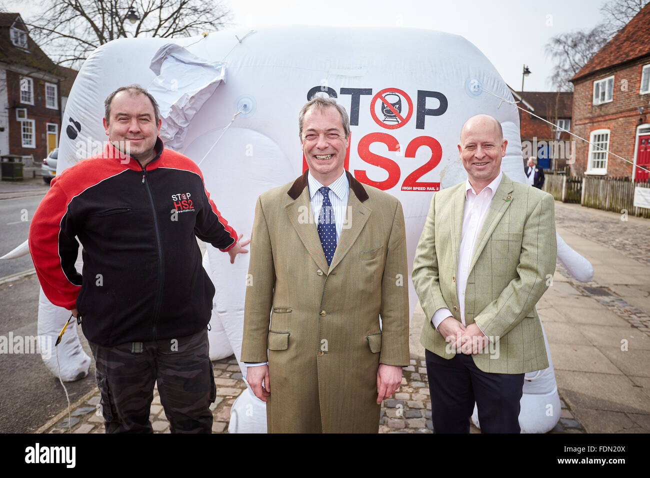 UKIP party leader Nigel Farage poses in front of the Stop HS2 inflatable white elephant with Chris Adams (R) and Joe Rukin (L) Stock Photo