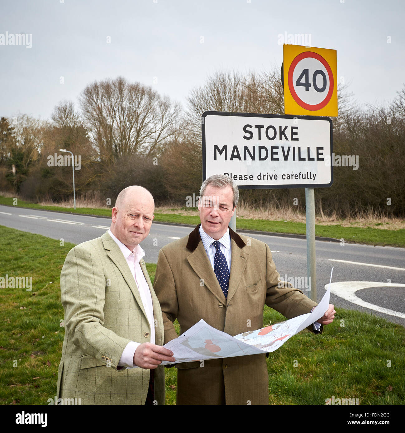 UKIP party leader Nigel Farage (R) pictured where HS2 will cross a major road in Stoke Mandeville with Chris Adams (L) Stock Photo