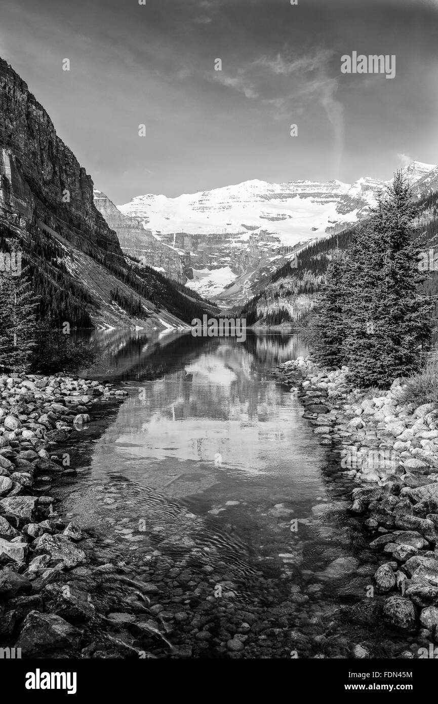 scenic view with reflections in Lake Louise in Banff National Park, Alberta, Canada -black and white Stock Photo