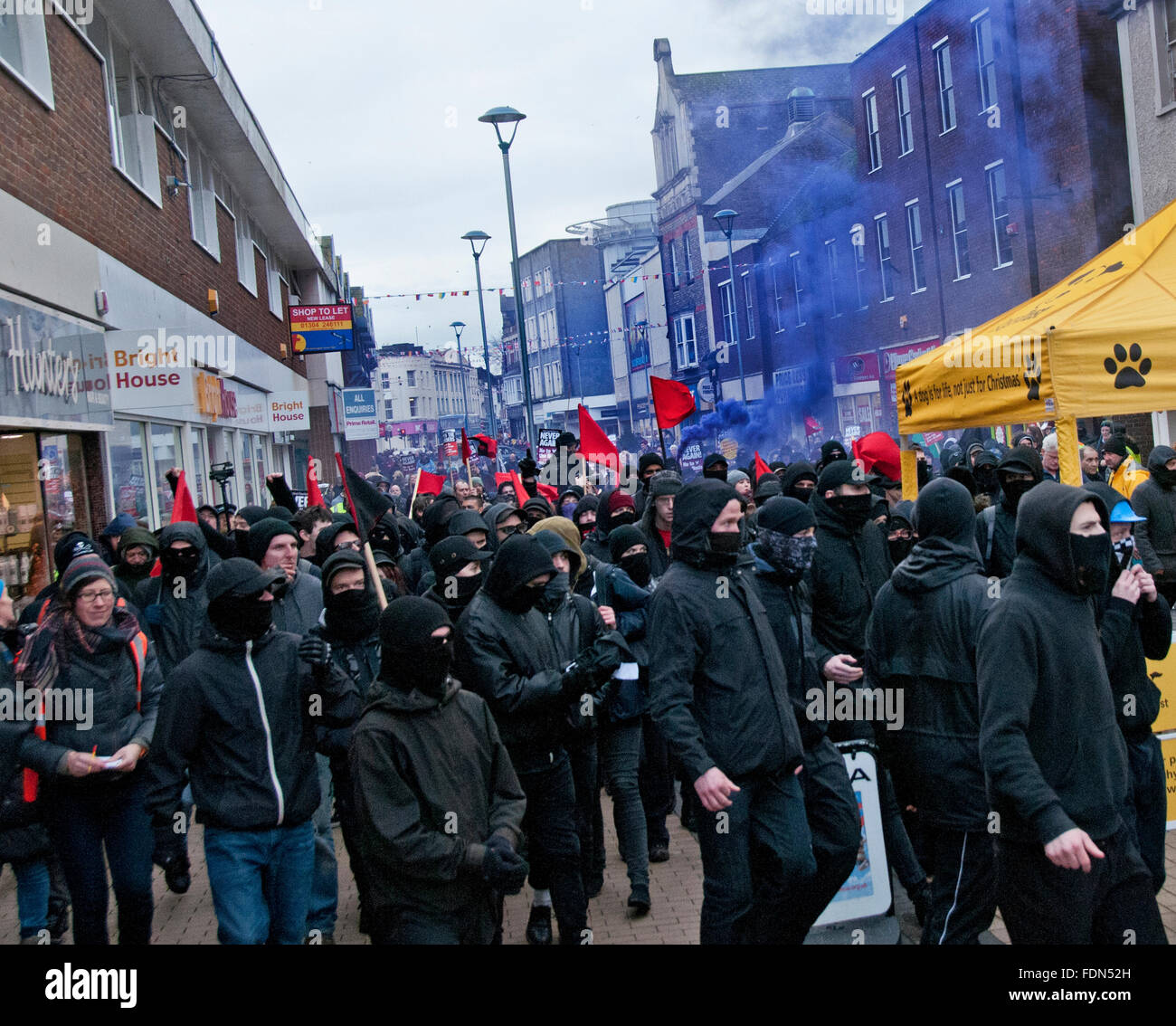 Unite Against Fascism UAF combating the Far Right  groups at Anti-Immigration anti-Refugee rally organised by the National Front Stock Photo