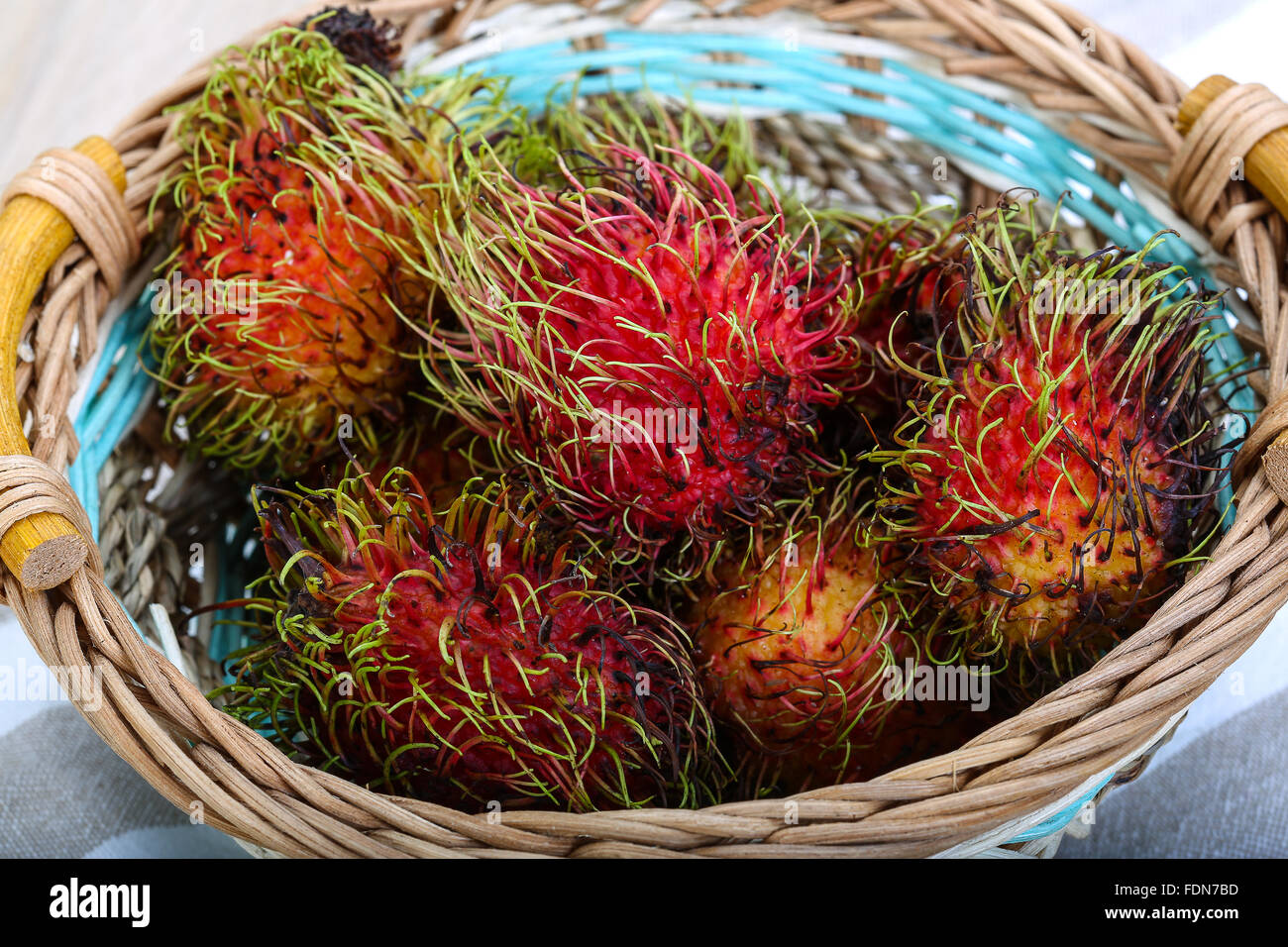 Fresh ripe sweet rambutan in the basket Stock Photo - Alamy