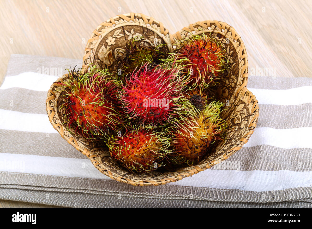 Fresh ripe sweet rambutan in the basket Stock Photo - Alamy