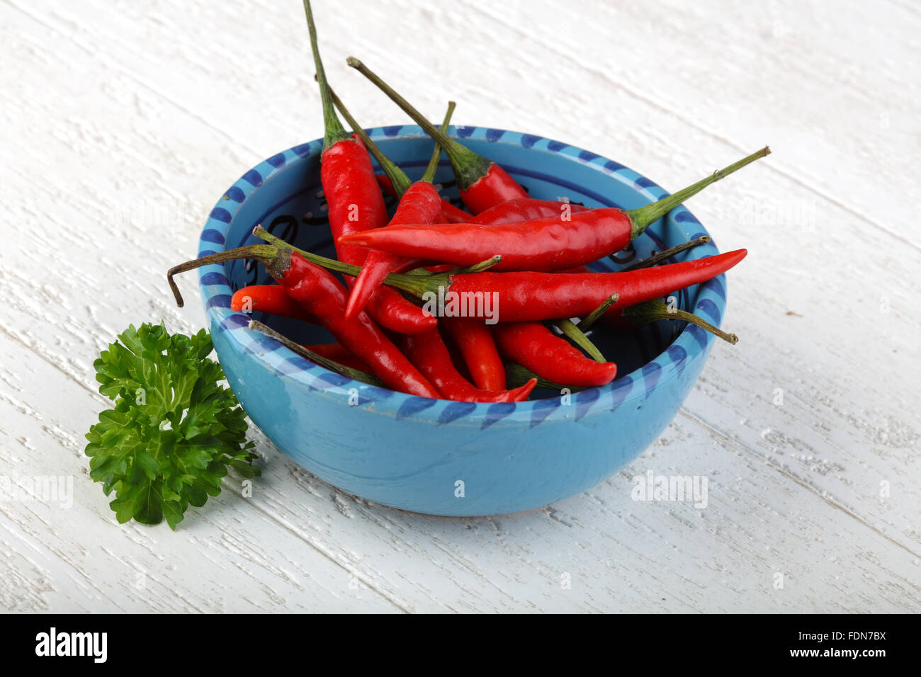 Red hot chili peppers heap on the wood background Stock Photo - Alamy