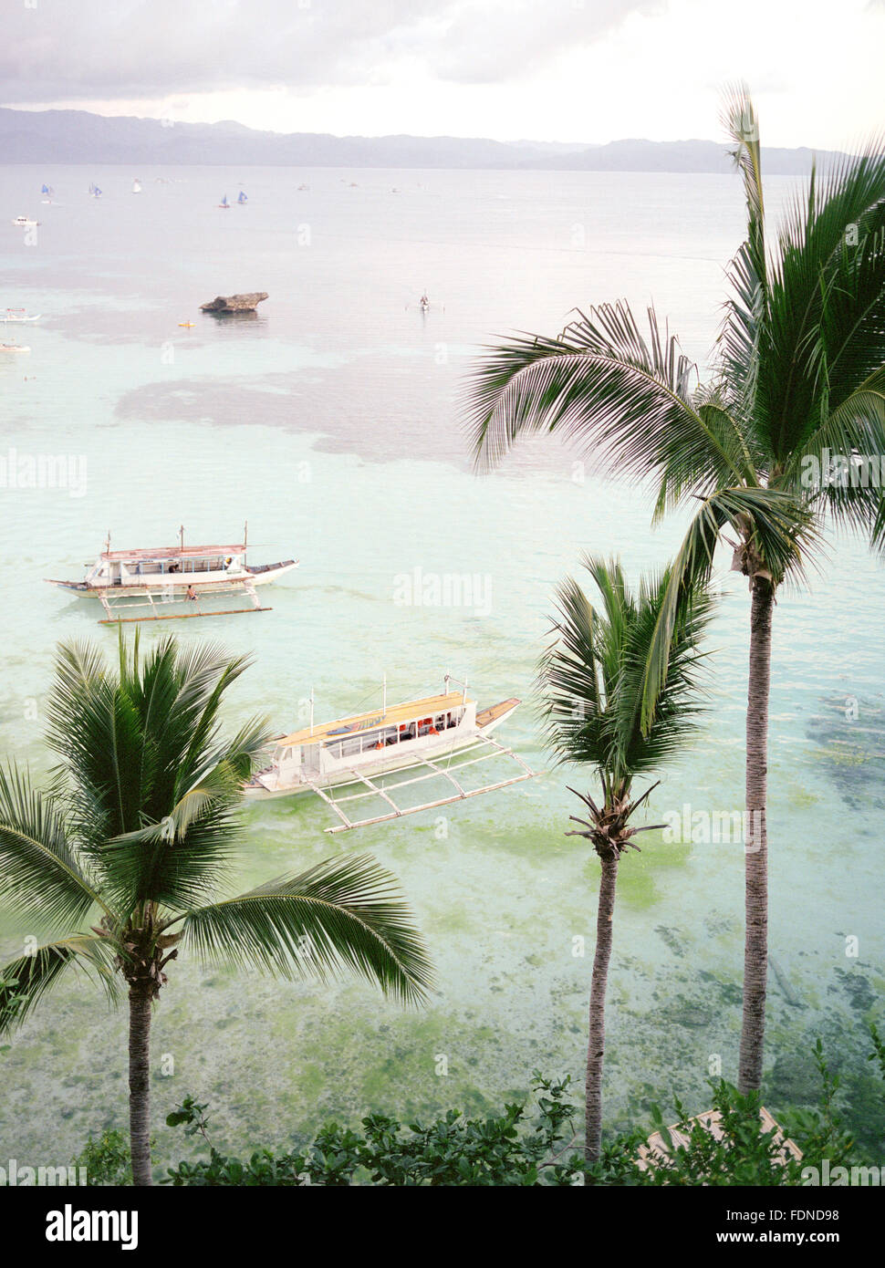 Boats float in the Sibuyan Sea off of Boracay, Philippines, South East