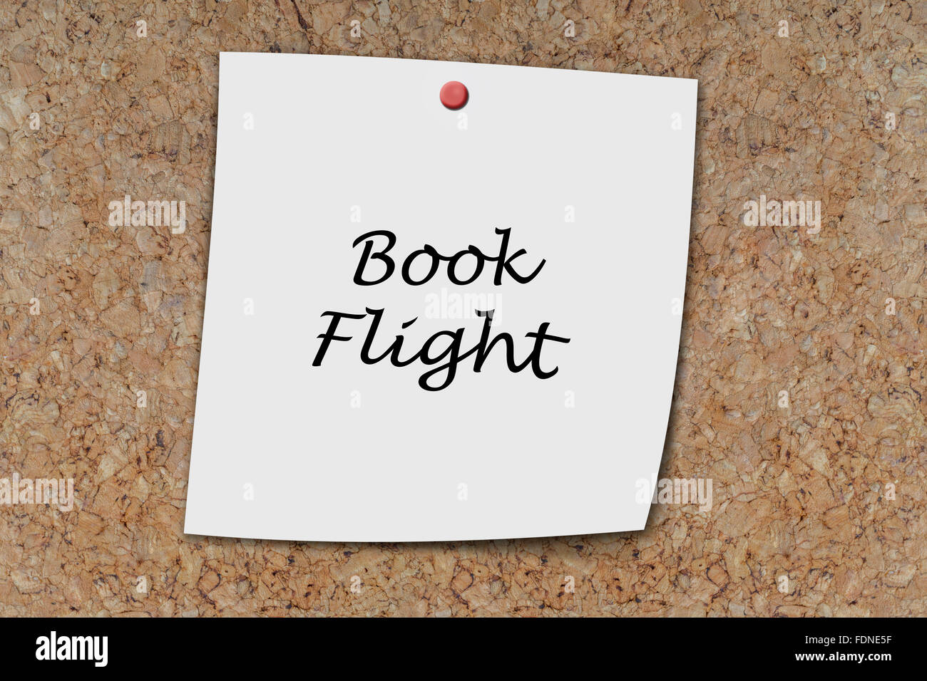 Book FLight written on a memo pinned on a cork board Stock Photo