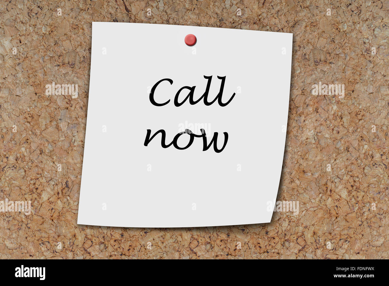 Call Now written on a memo pinned on cork board Stock Photo