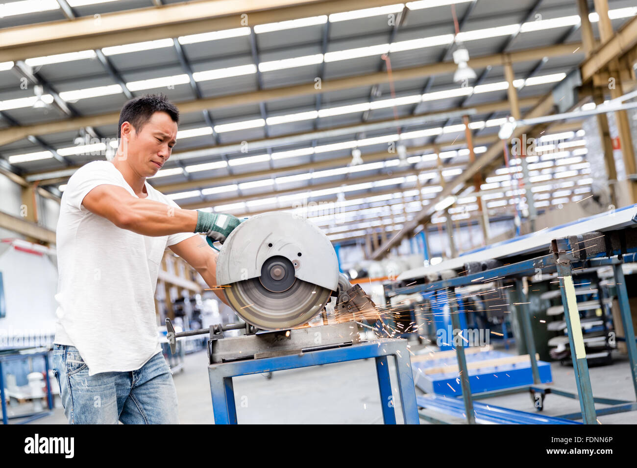 portrait of asian worker in production plant working on the factory ...