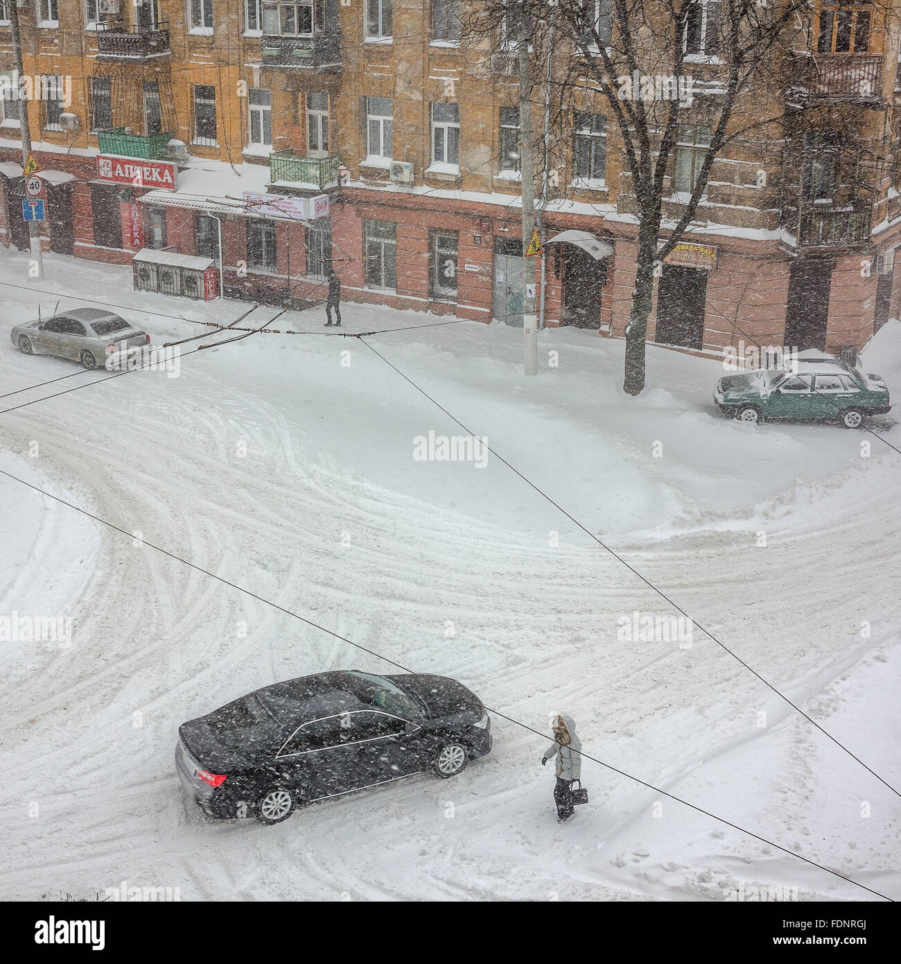 Odessa, Ukraine - January 18, 2016: A powerful cyclone, storm, heavy snow paralyzed the city. People walking on the street durin Stock Photo