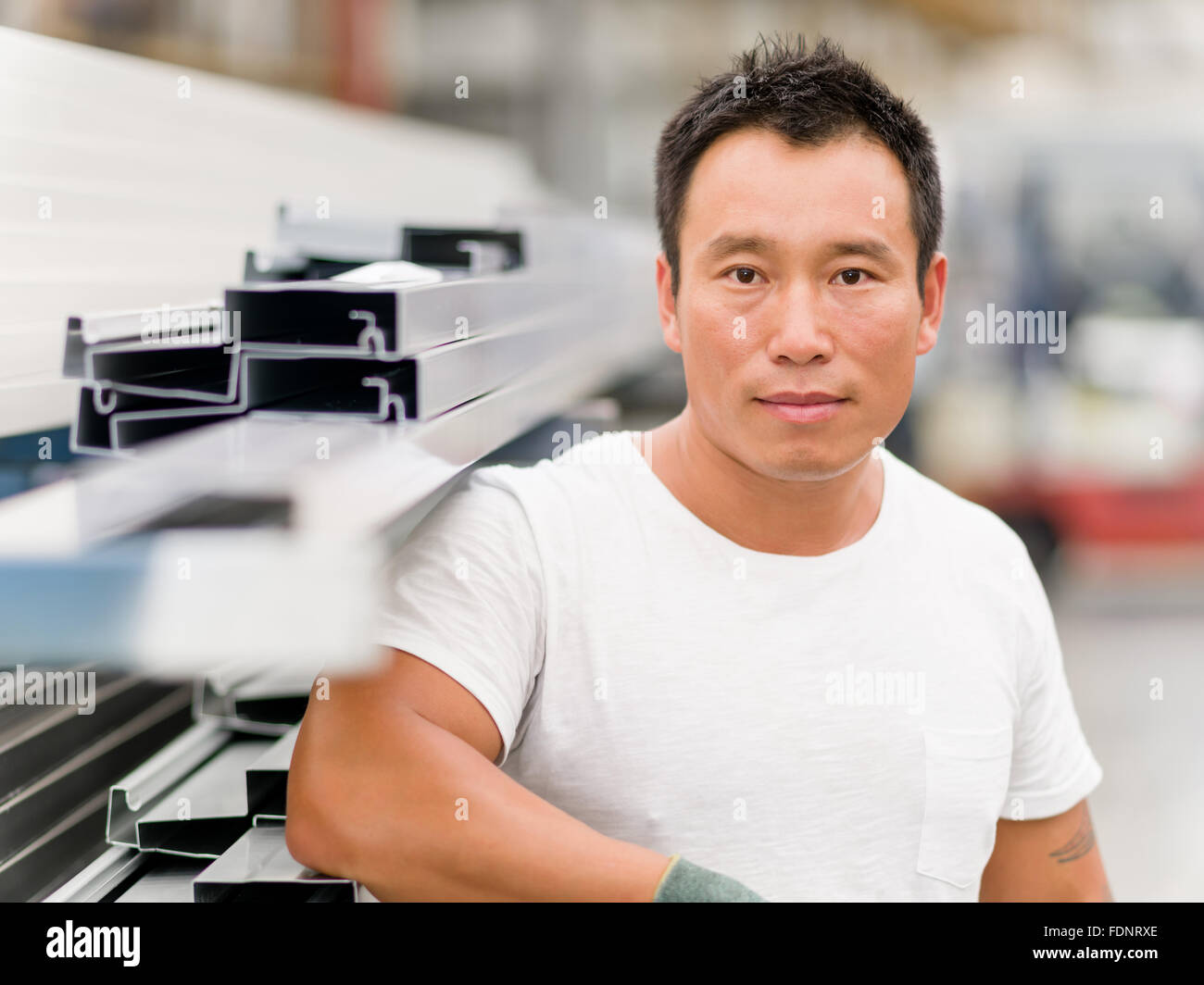 portrait of asian worker in production plant working on the factory