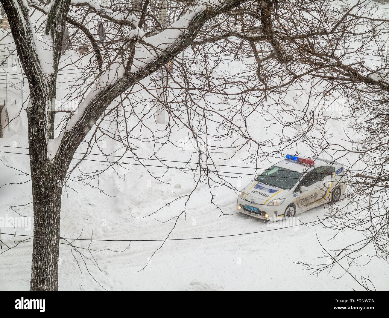 Odessa, Ukraine - January 18, 2016: A powerful cyclone, storm, heavy snow paralyzed the city. People walking on the street during a snowfall. Stopped Stock Photo