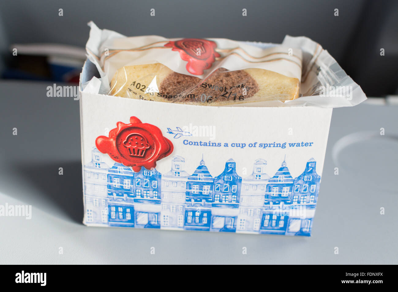 Complimentary snack of cake and water provided on KLM flight between Amsterdam and Stockholm Stock Photo