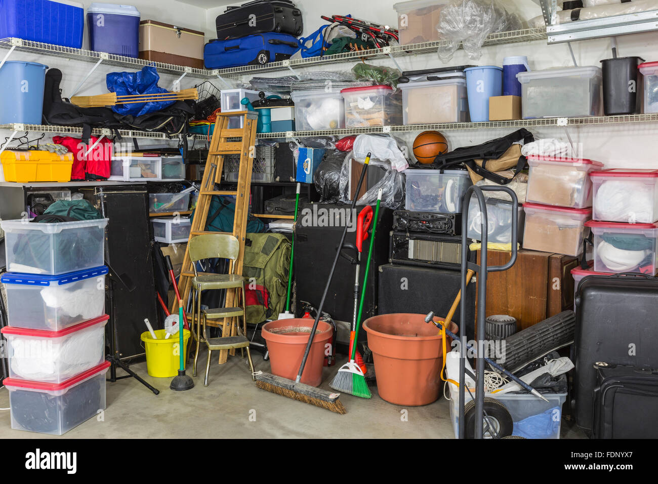 Residential garage full of junk and storage. Stock Photo