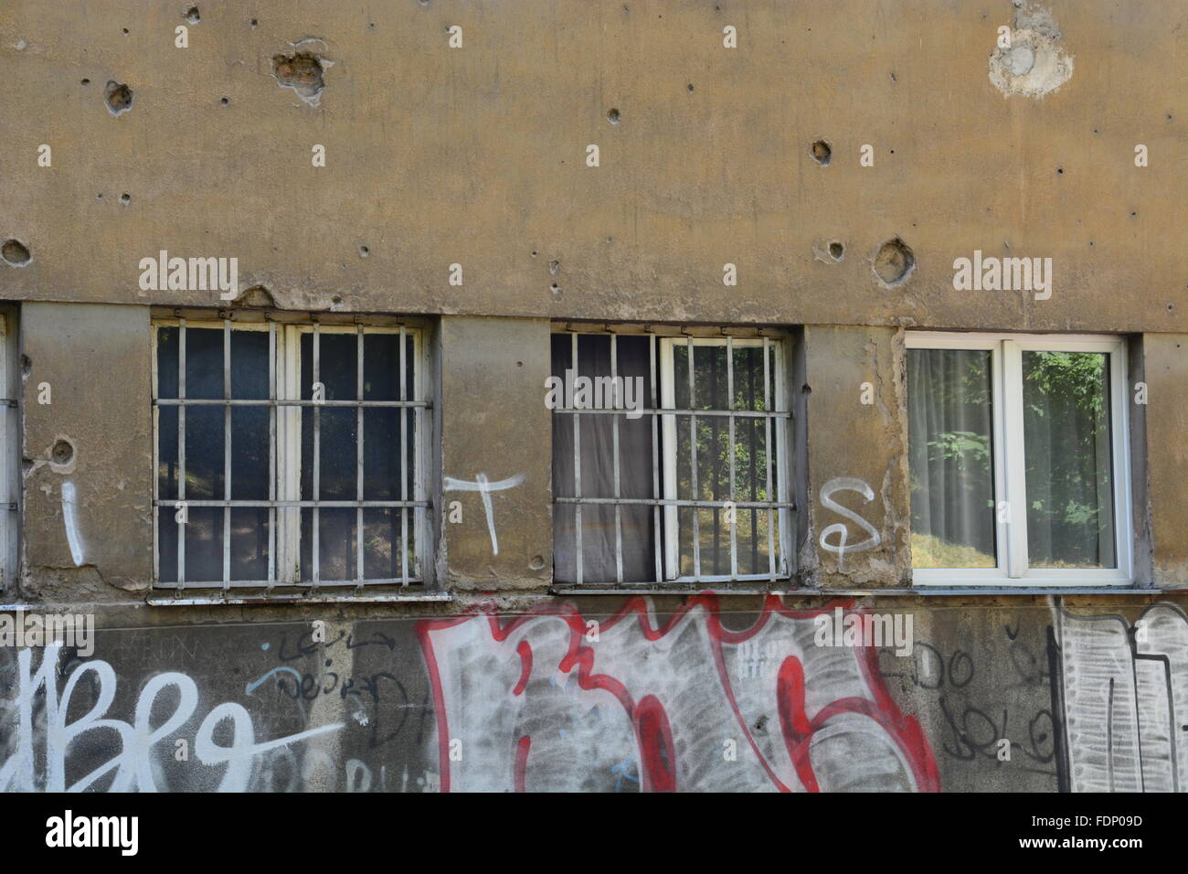 Damage from a bullet scarred apartment building in Sarajevo provides a reminder of the Bosnian War Stock Photo