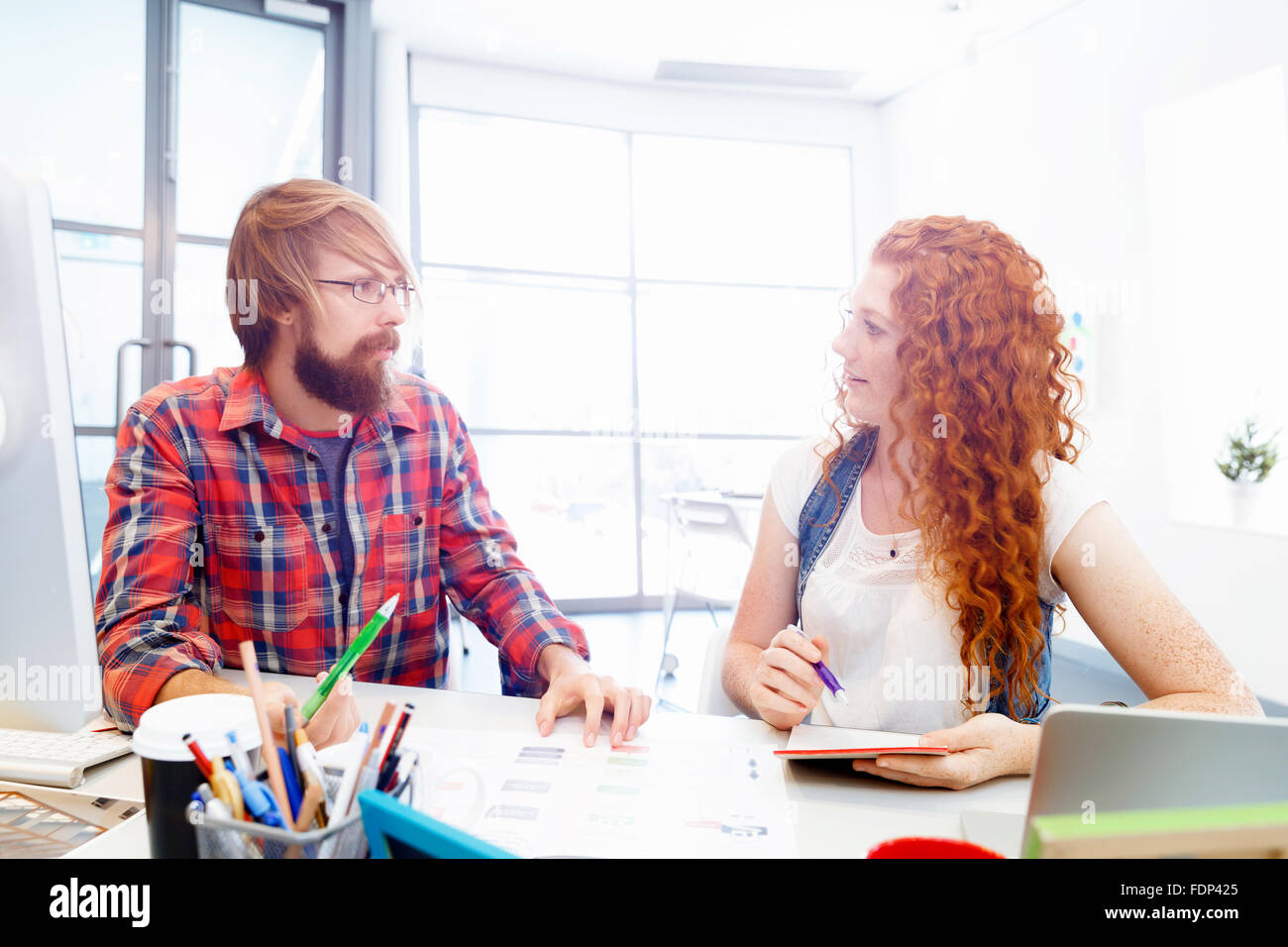 Business team working together in office Stock Photo - Alamy