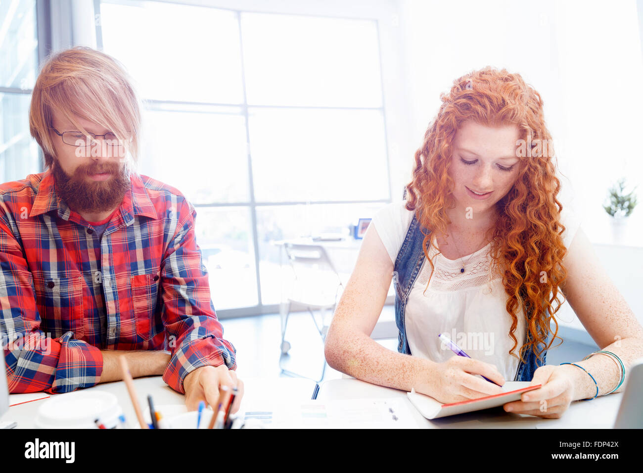Business team working together in office Stock Photo - Alamy