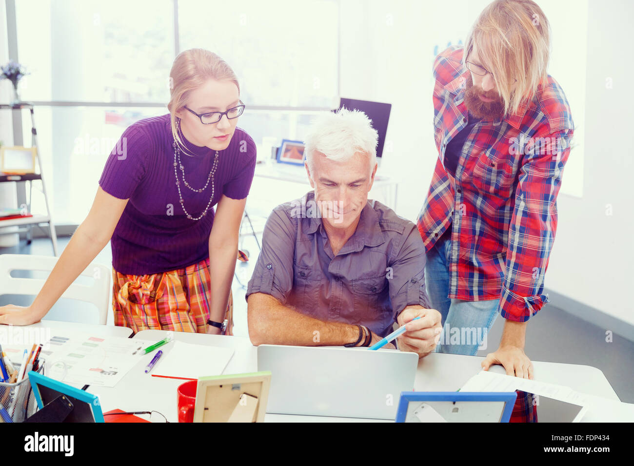 Business team working together in office Stock Photo - Alamy