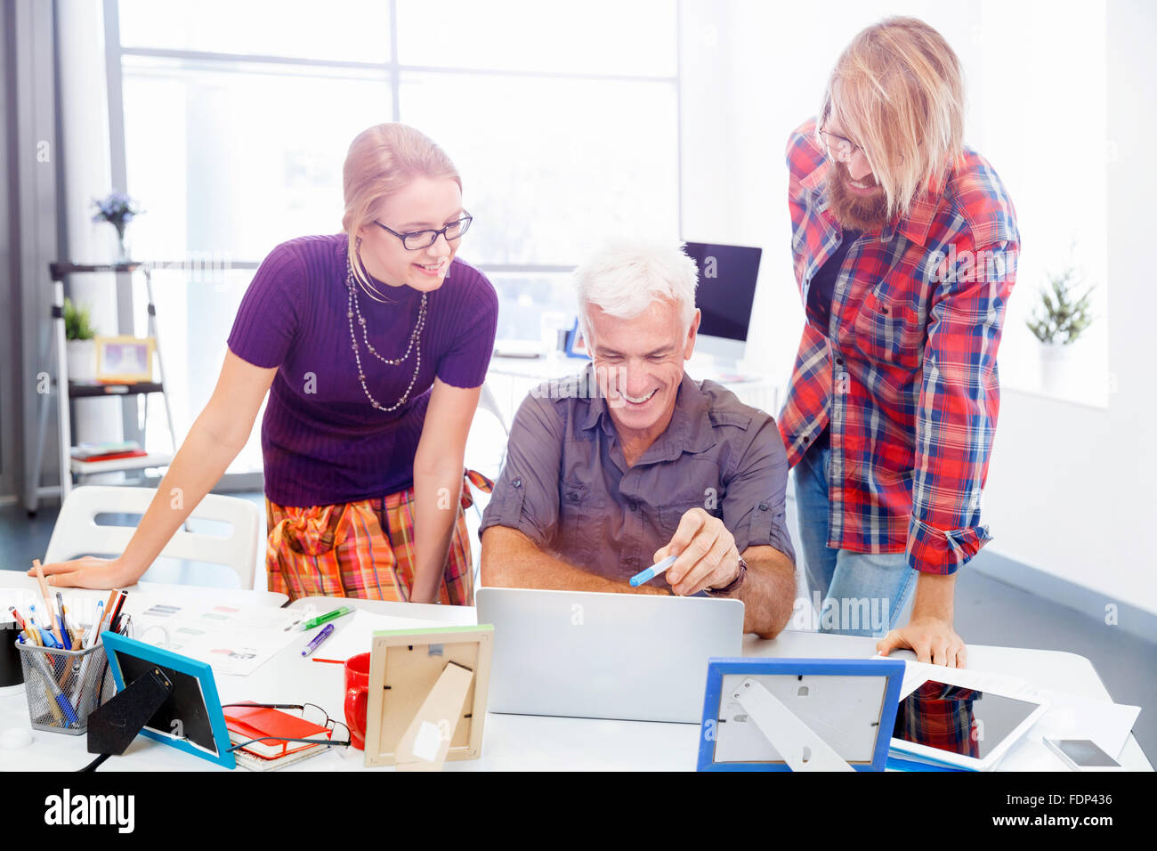 Business team working together in office Stock Photo - Alamy