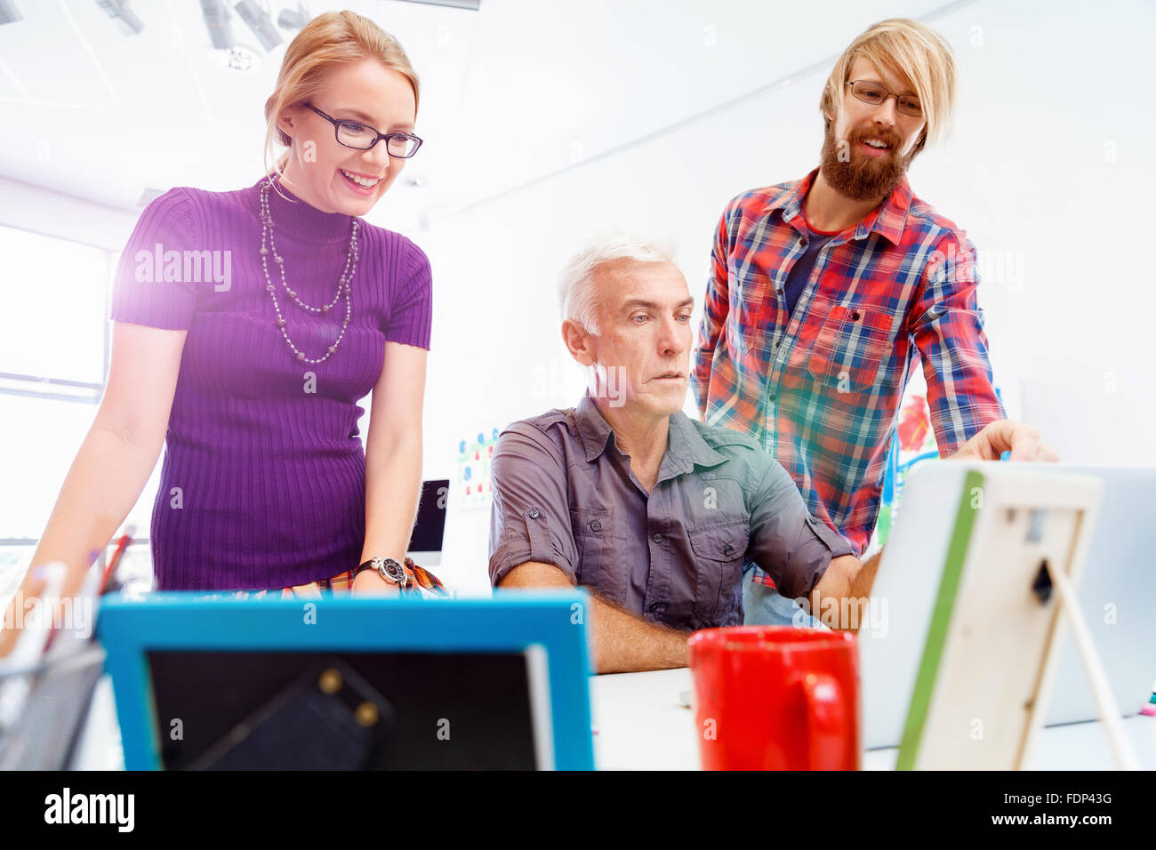 Business team working together in office Stock Photo - Alamy