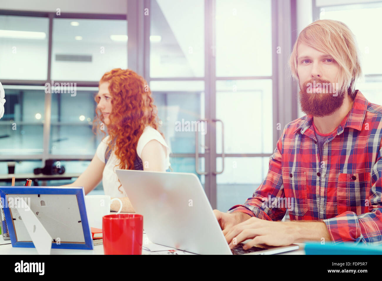 Business team working together in office Stock Photo - Alamy
