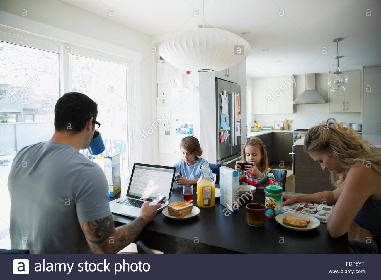 Mid Adult Man Using Mobile Phone Kitchen High Resolution Stock