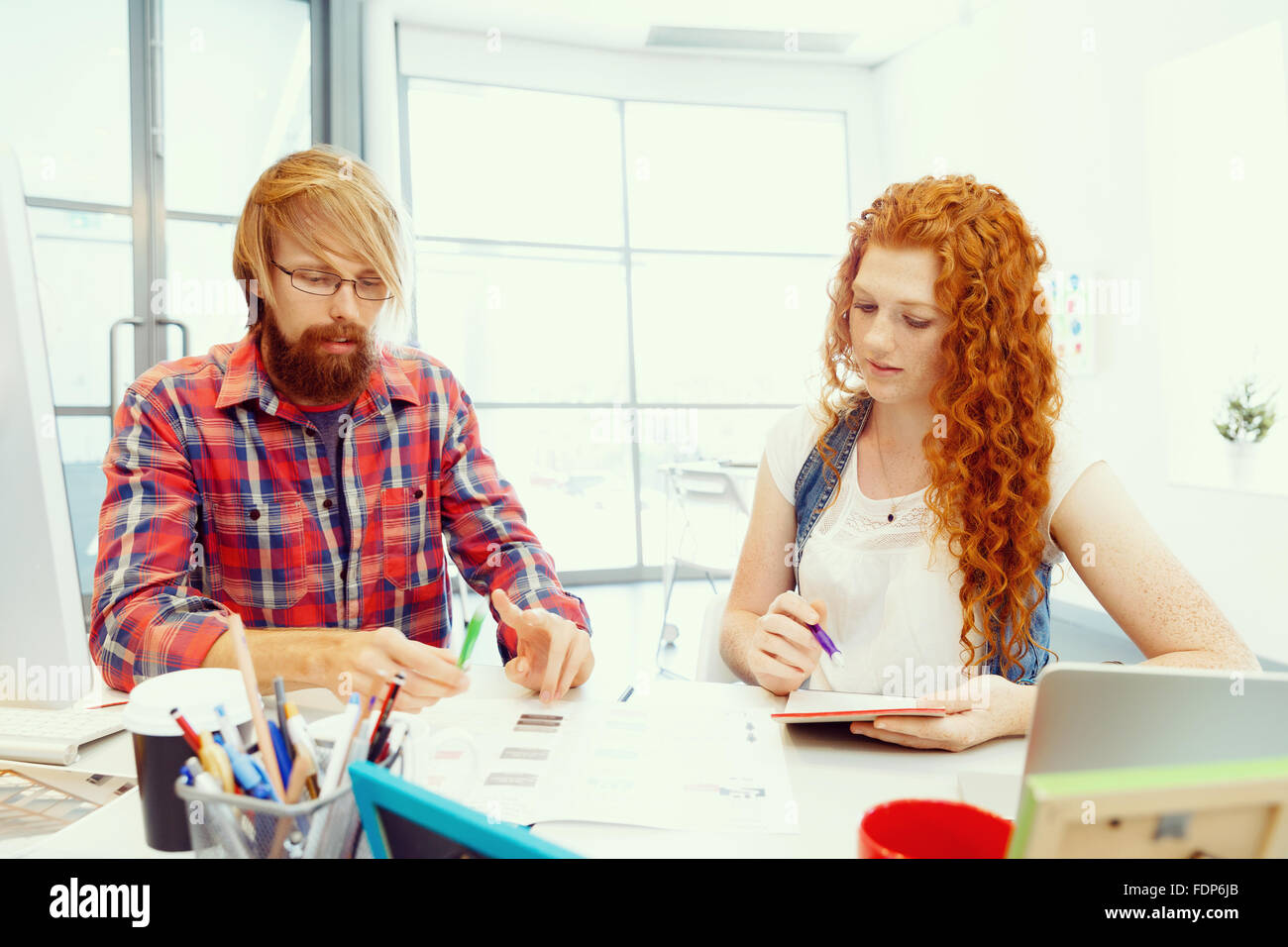 Business team working together in office Stock Photo - Alamy