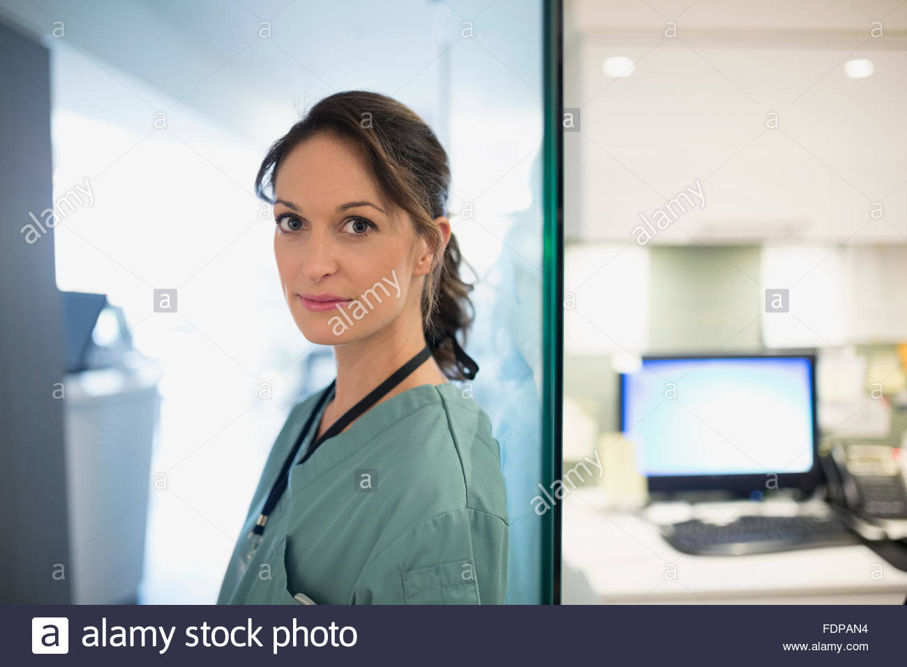 Portrait confident nurse at nurses station Stock Photo - Alamy