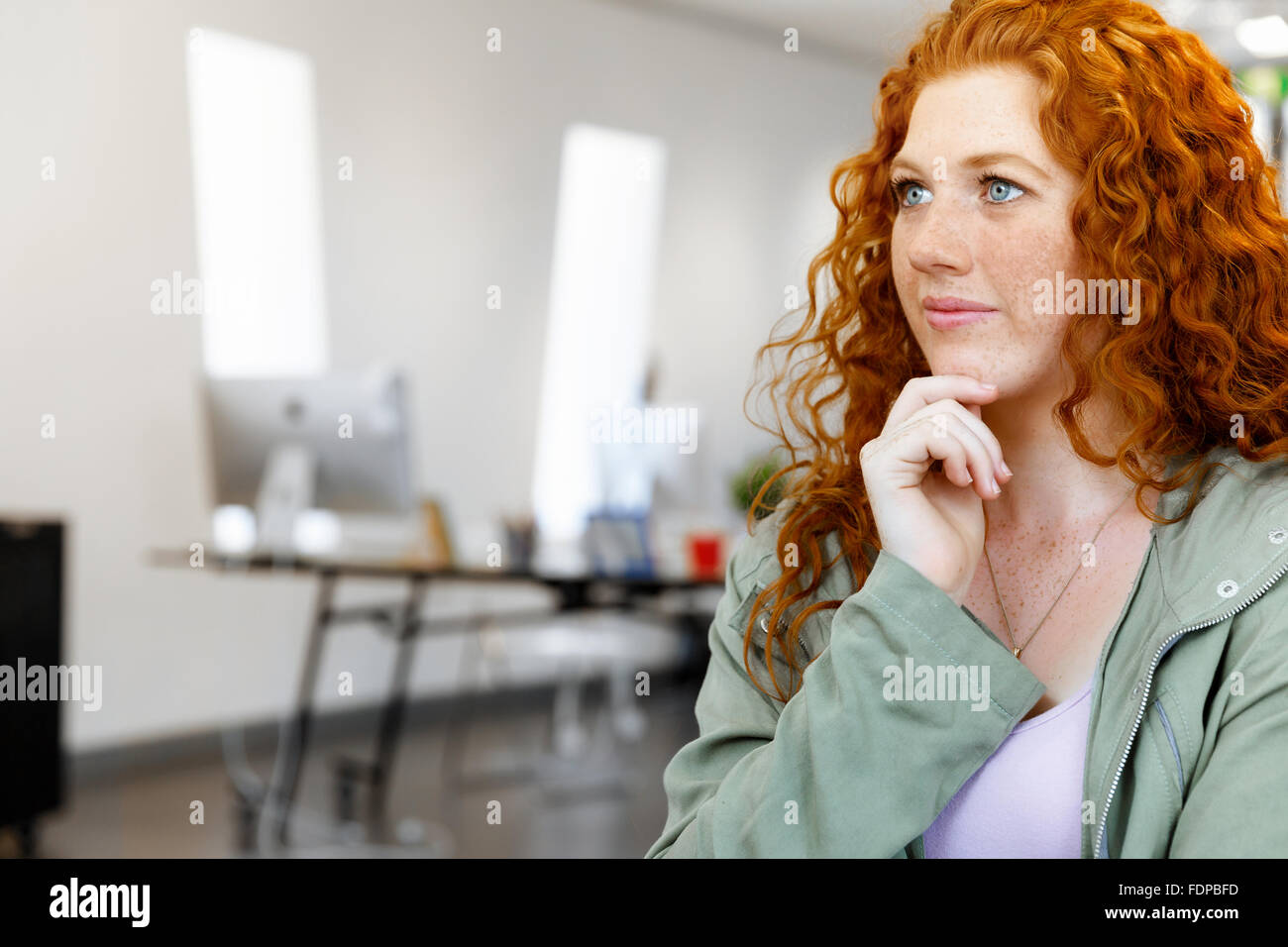 Young and pretty business woman in office Stock Photo - Alamy
