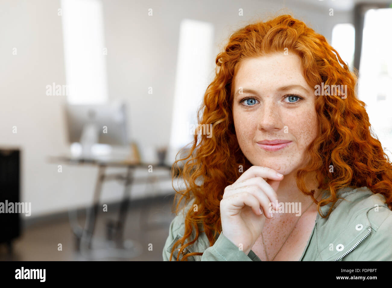 Young and pretty business woman in office Stock Photo - Alamy