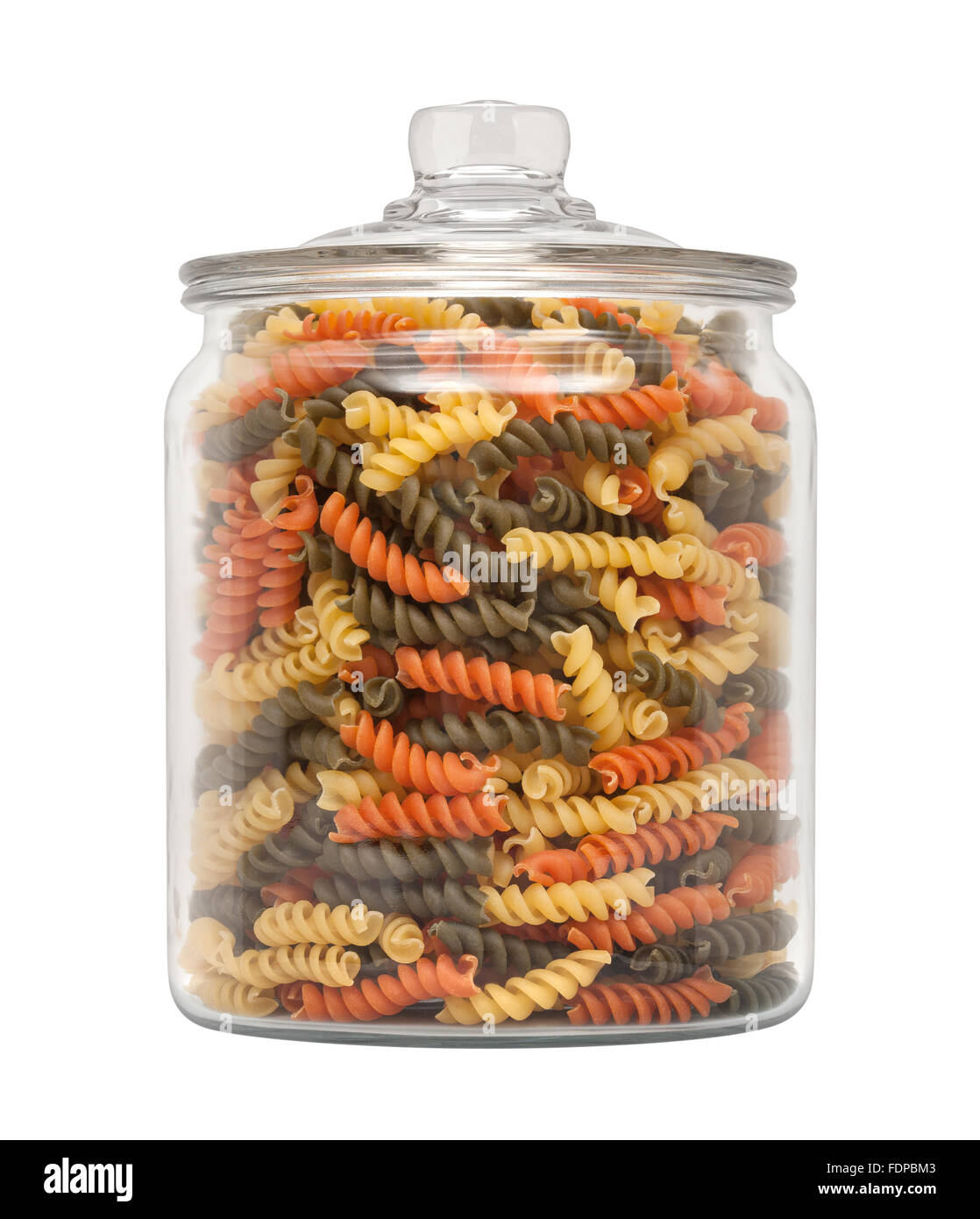 Rainbow Rotini Pasta in a Apothecary Jar. The image is a cut out, isolated on a white background. Stock Photo