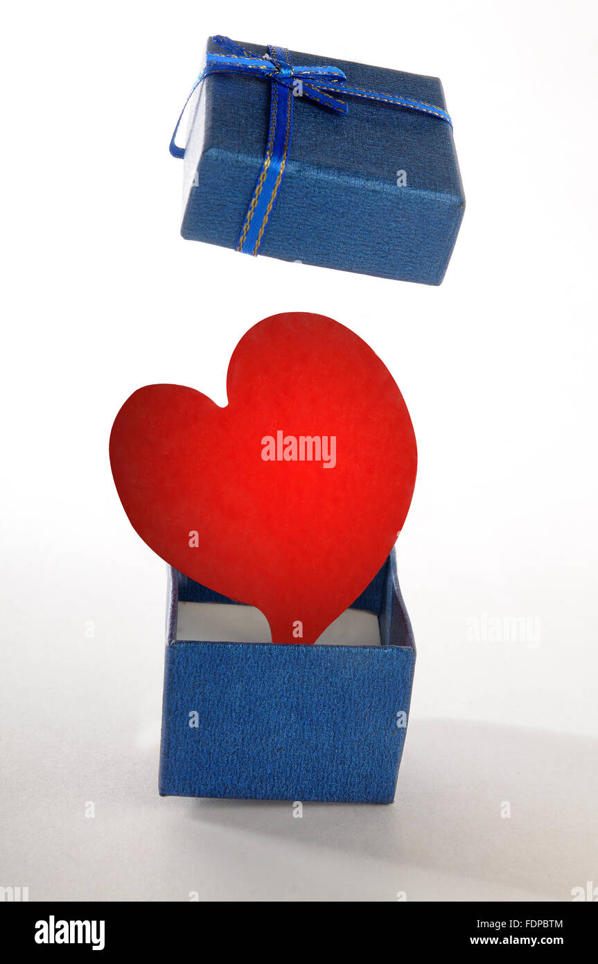 Red Hearth opening a blue gift box Stock Photo