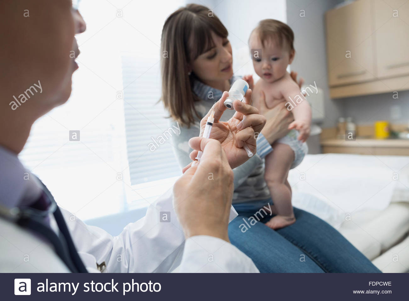 Doctor injection baby hires stock photography and images Alamy