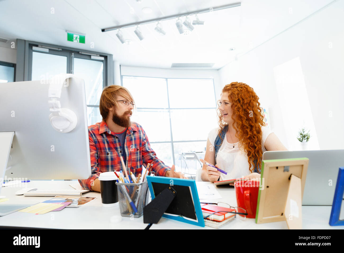 Business team working together in office Stock Photo - Alamy