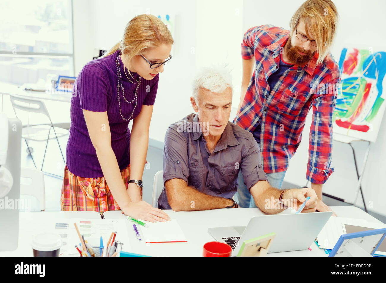 Business team working together in office Stock Photo - Alamy