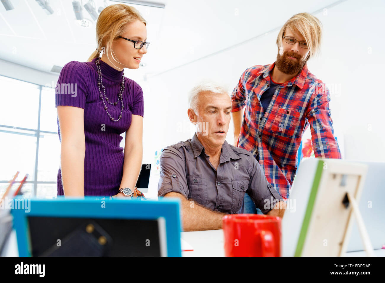 Business team working together in office Stock Photo - Alamy