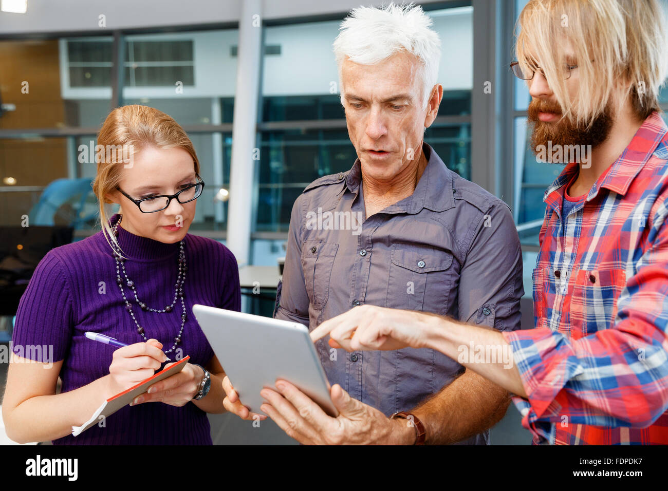 Business team working together in office Stock Photo - Alamy