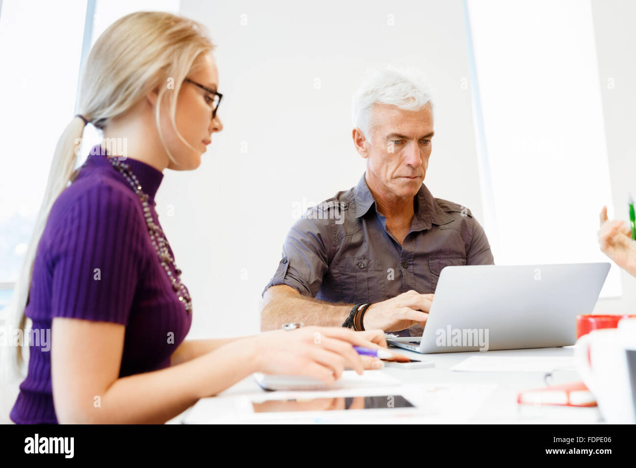 Business team working together in office Stock Photo - Alamy