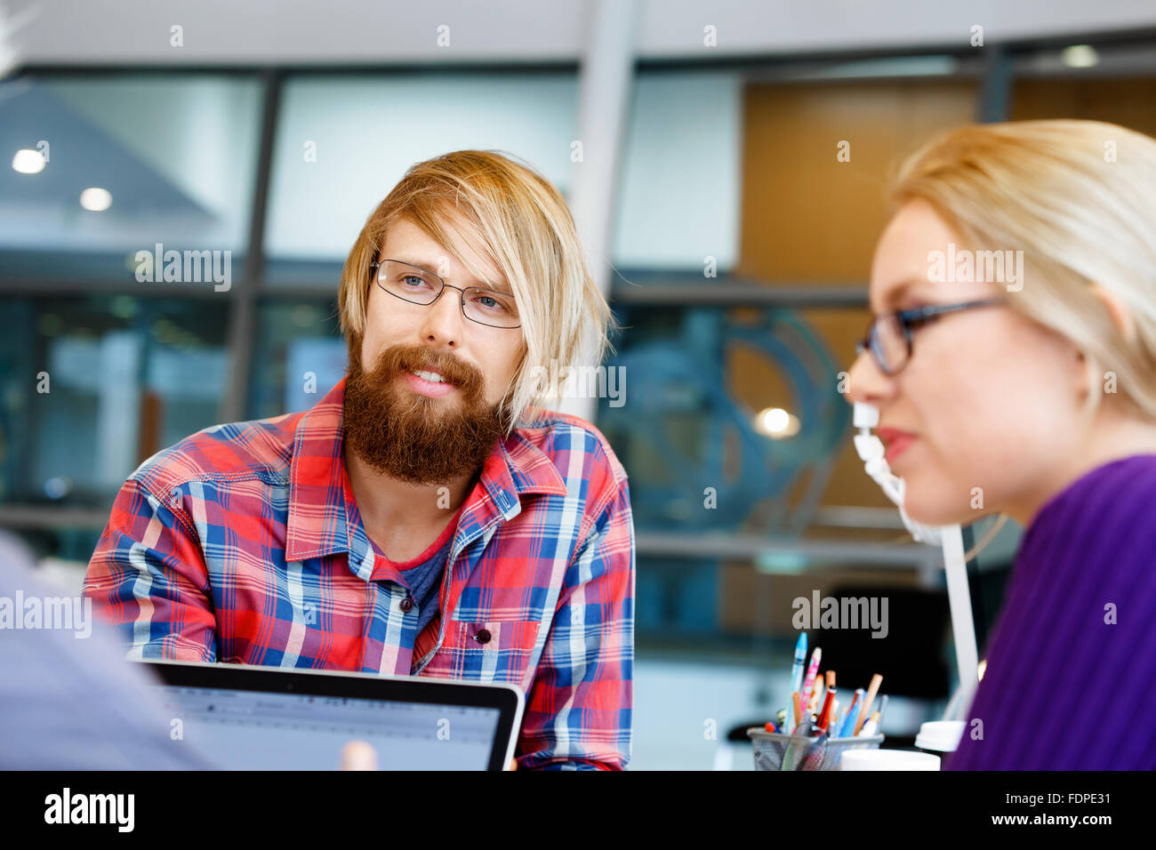 Business team working together in office Stock Photo - Alamy