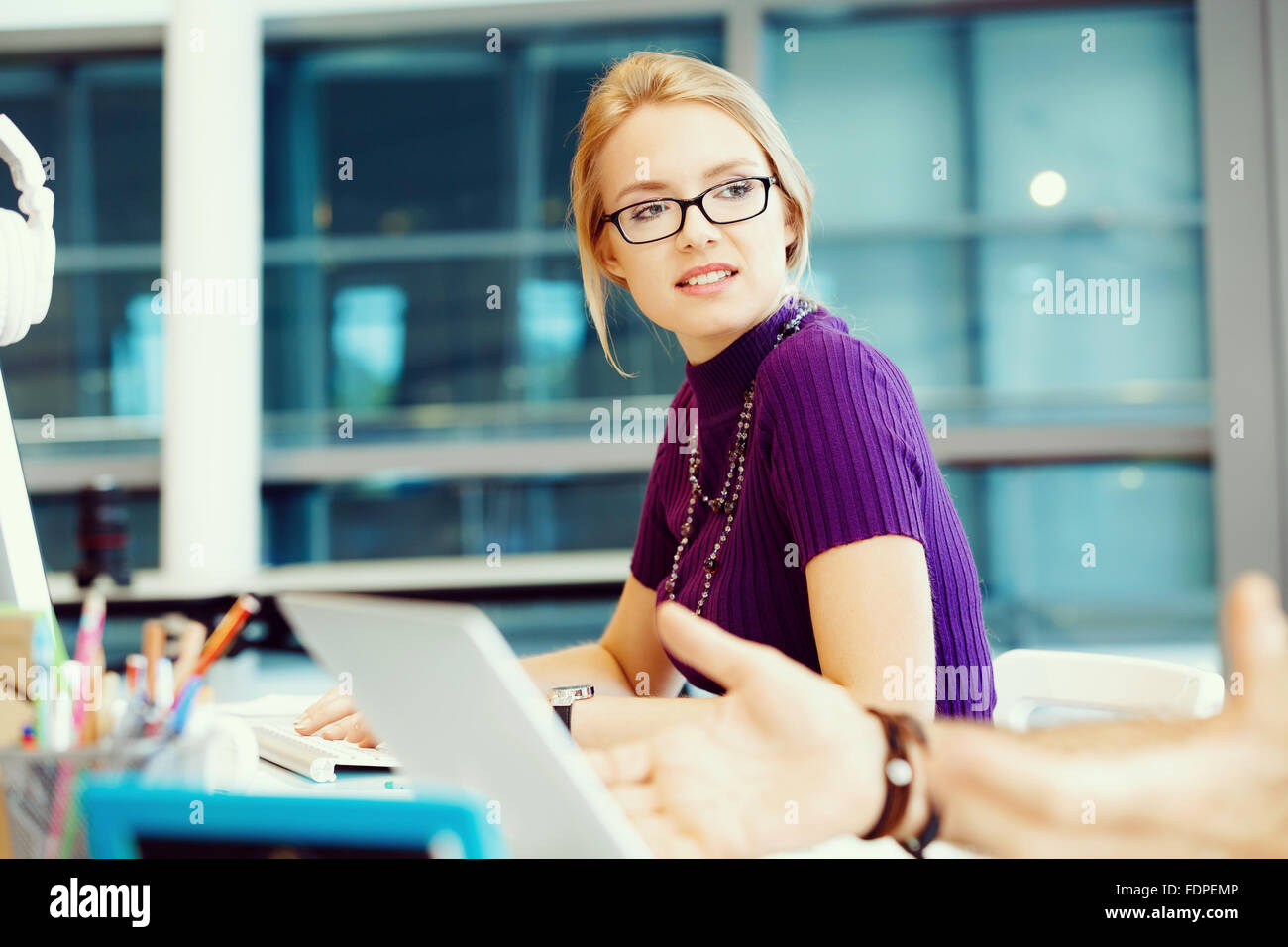 Young and pretty business woman working in office Stock Photo - Alamy