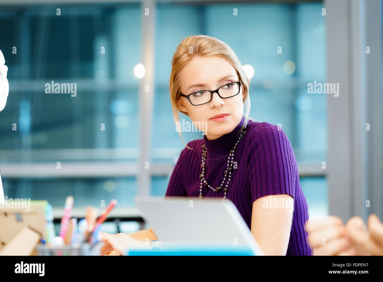 Young and pretty business woman working in office Stock Photo - Alamy
