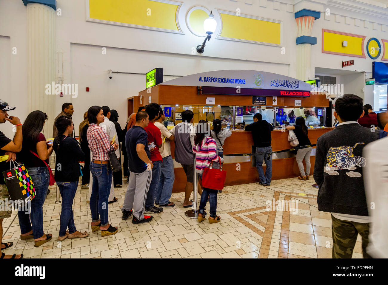 Migrant Workers Queue To Send Home Money, Doha, Qatar Stock Photo Alamy