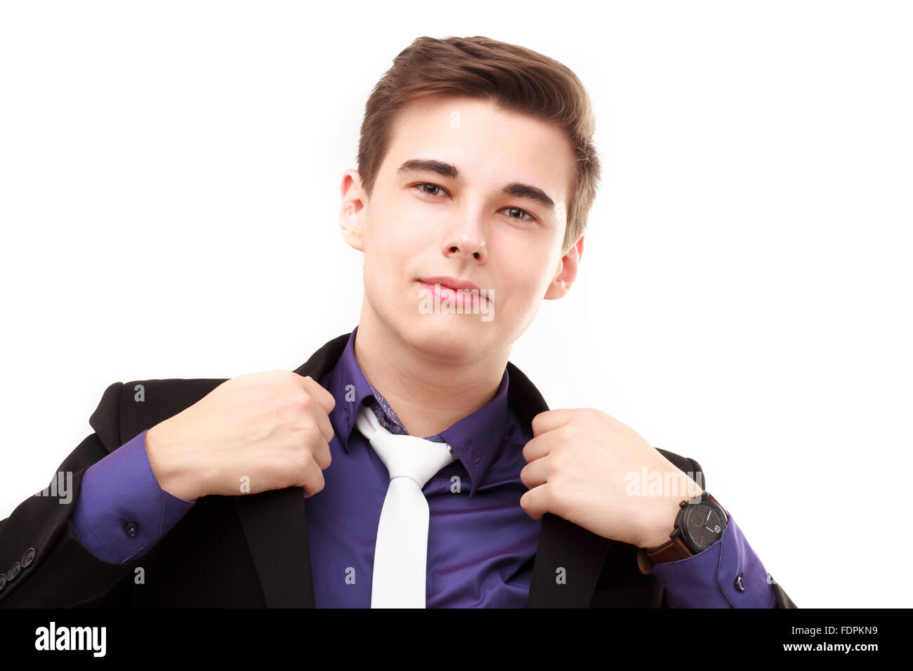 Close-up portrait of young business man wearing suit and tie isolated ...