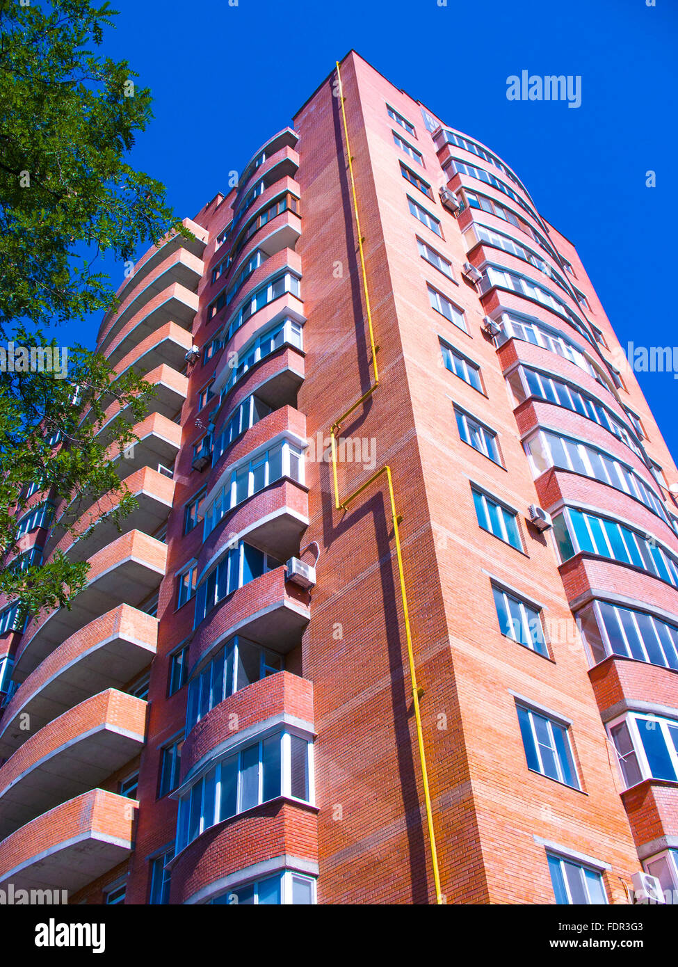high residential house on blue sky background with trees Stock Photo ...