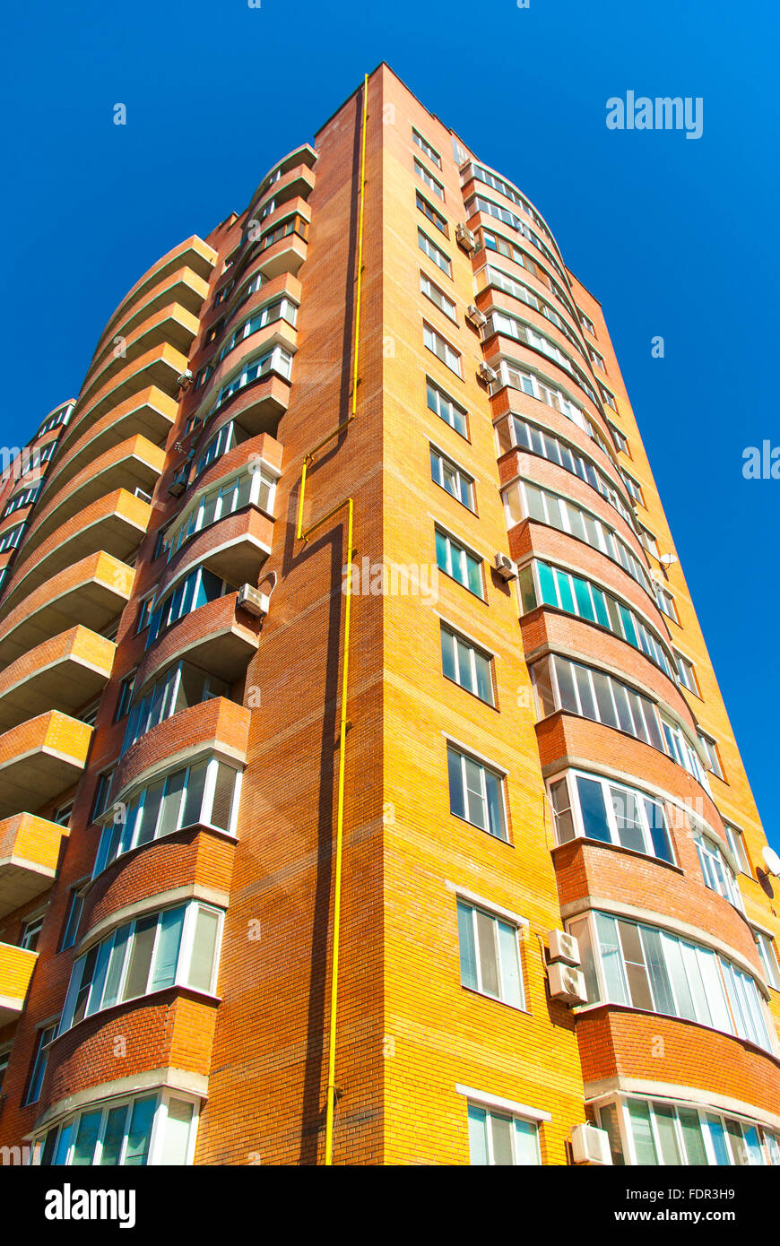 high residential house on blue sky background with trees Stock Photo ...
