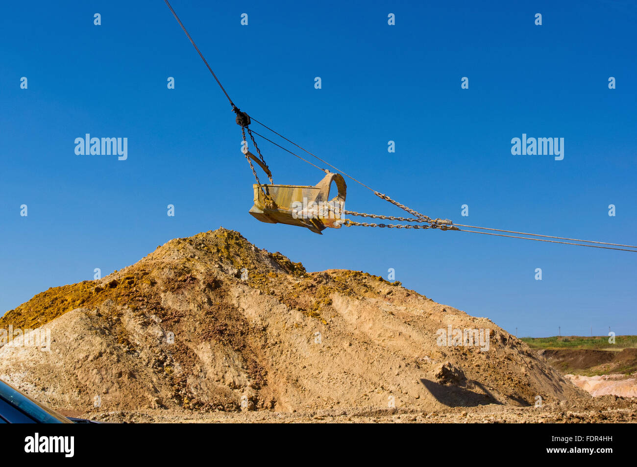 huge walking excavator bucket on blue sky background Stock Photo Alamy