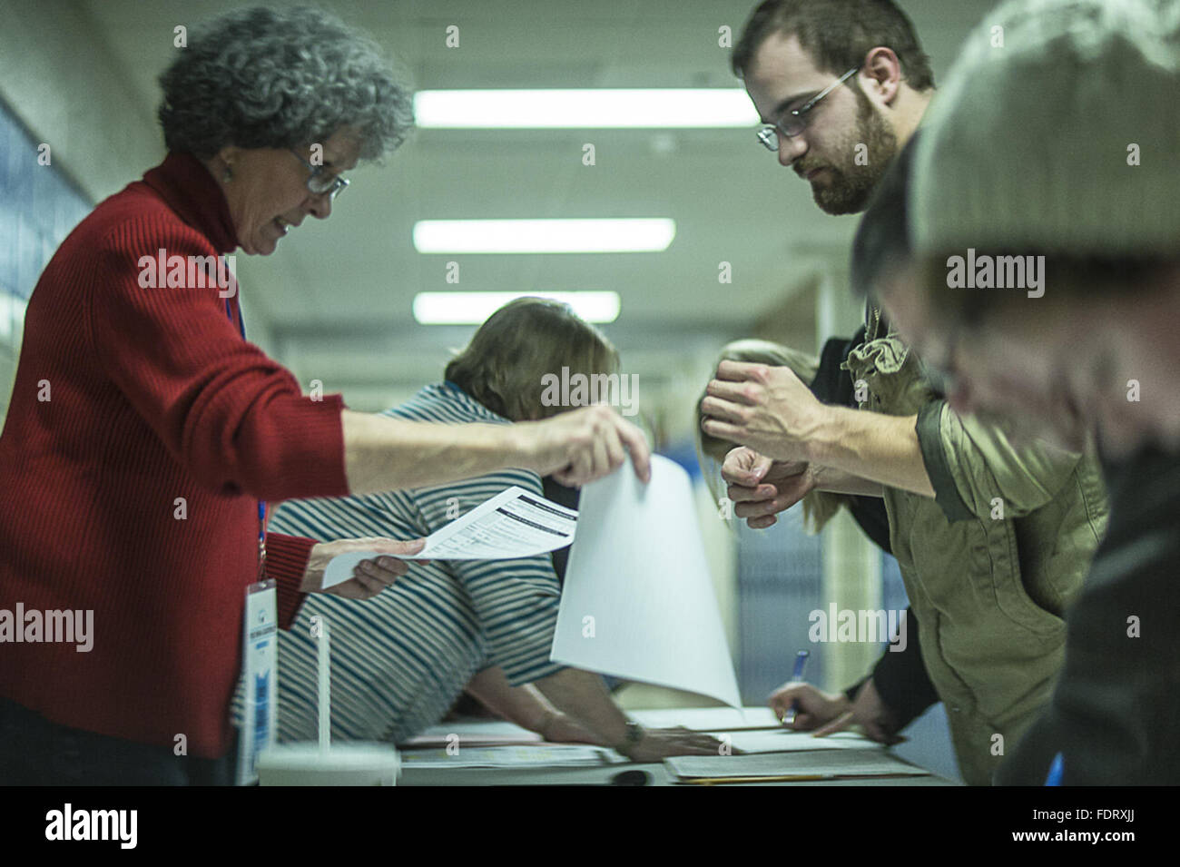Des Moines, Iowa, USA. 1st Feb, 2016. Democratic voters register for their party's caucus at Precinct 70 in Des Moines, Iowa, Feb. 1, 2016. The race between Clinton and Sen. Bernie Sanders was a virtual tie with nearly all votes reported in. Former Maryland Gov. Martin O'Malley dropped out of the race. Credit:  Bill Putnam/ZUMA Wire/Alamy Live News Stock Photo
