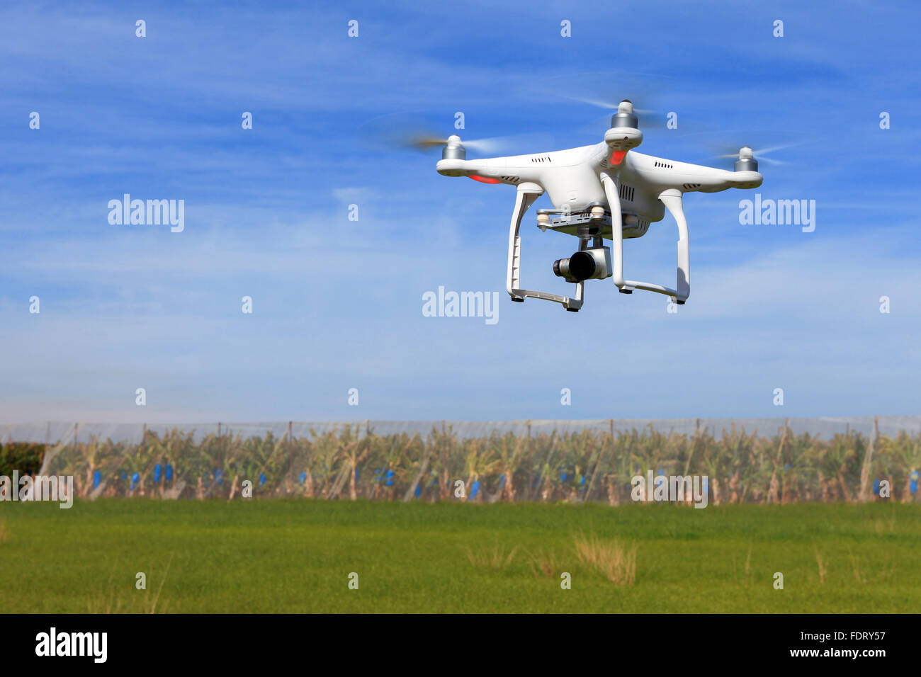 White drone equipped with high resolution 4K video camera Stock Photo