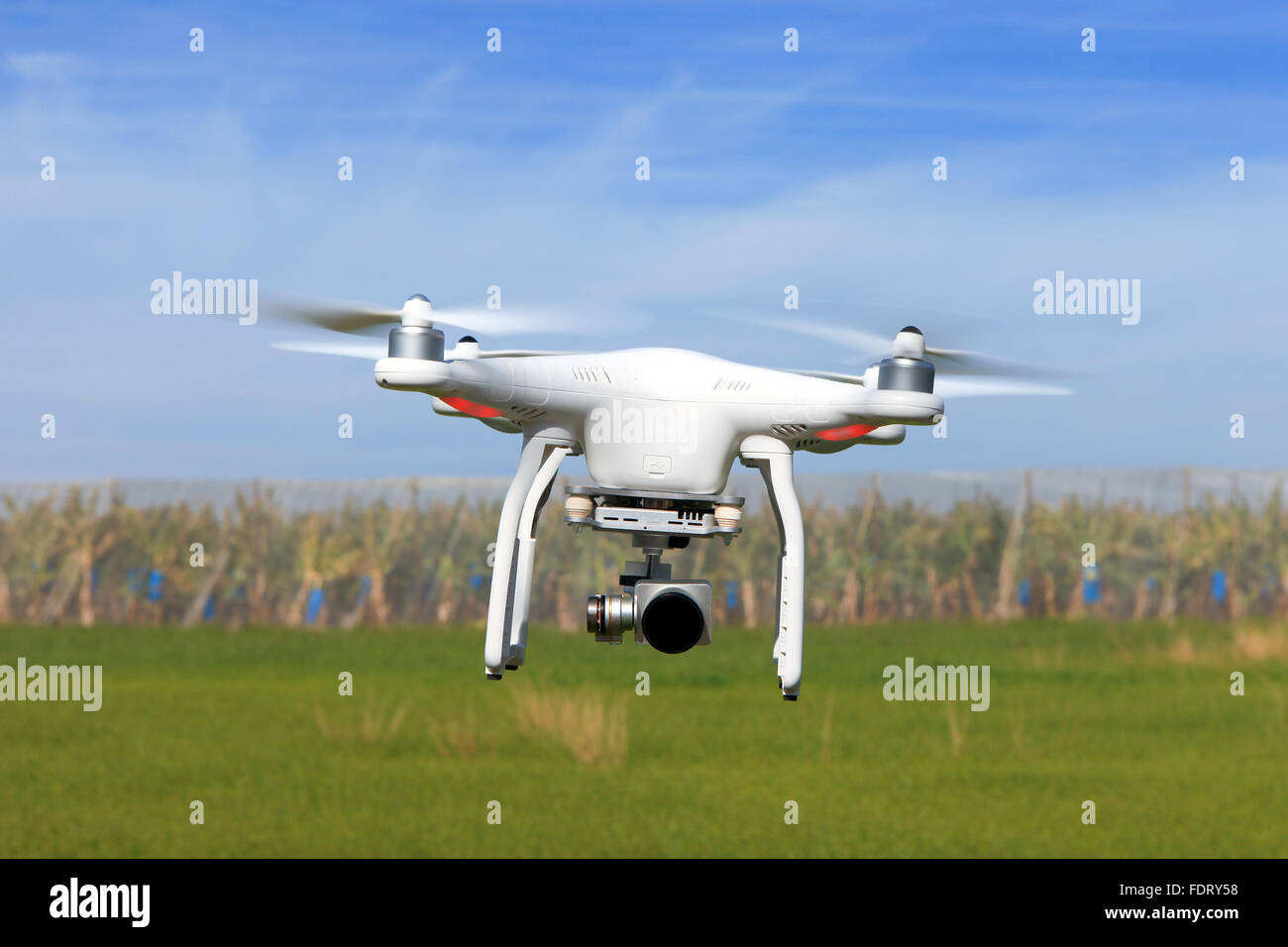 White drone equipped with high resolution 4K video camera Stock Photo